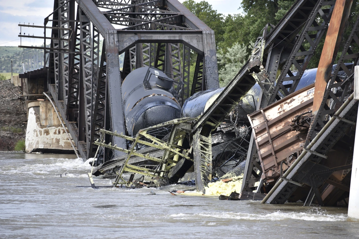 Train carrying hazardous materials derails and bridge collapses into Montana river