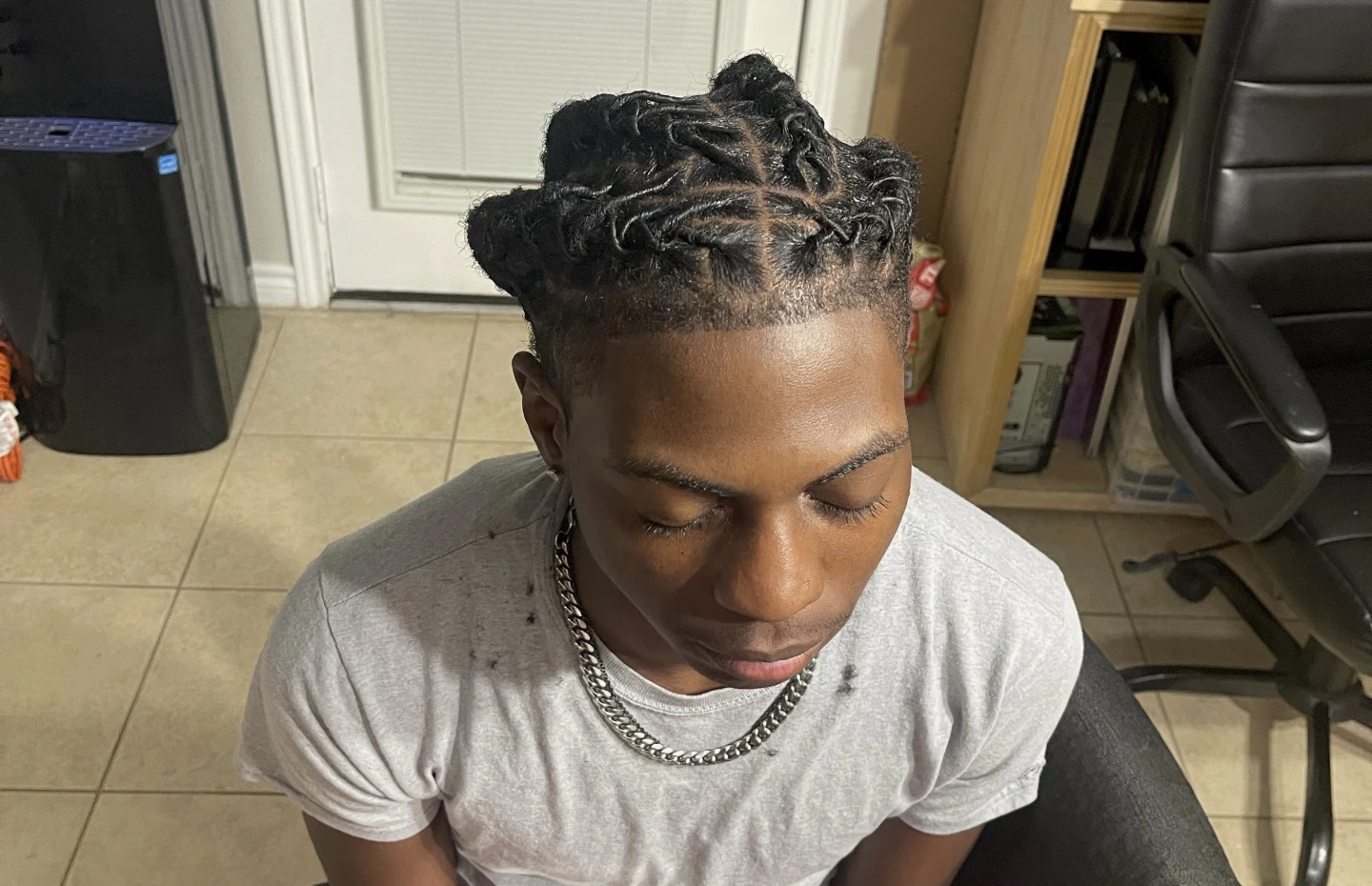 A Black student was suspended for his hairstyle. The school says it wasn’t discrimination