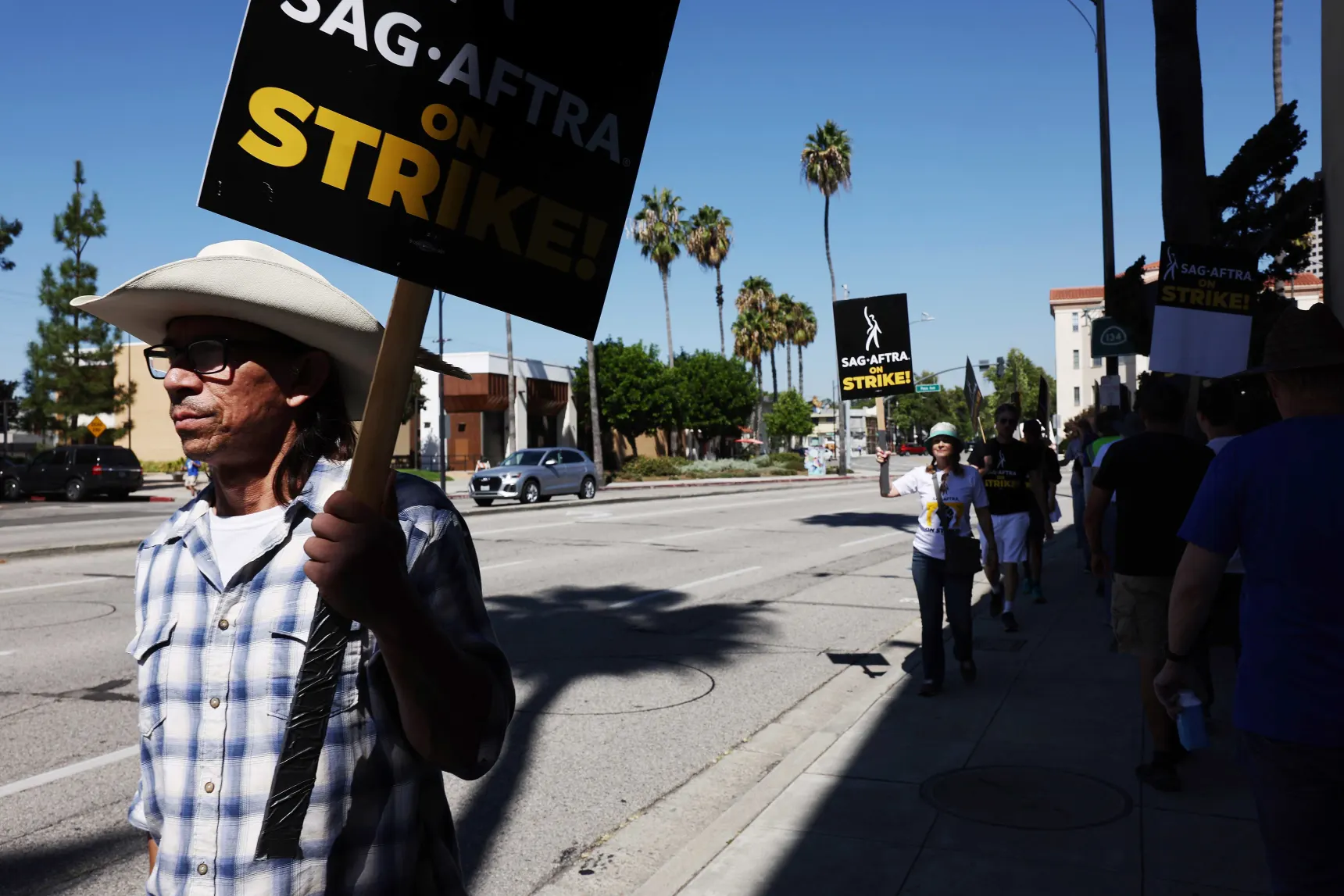 Hollywood writers can return to work after union and studios reach agreement to end strike