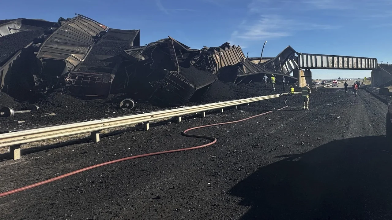 Colorado’s I-25 is partially closed after a coal train derailed off a bridge and killed a semi-truck driver, authorities say