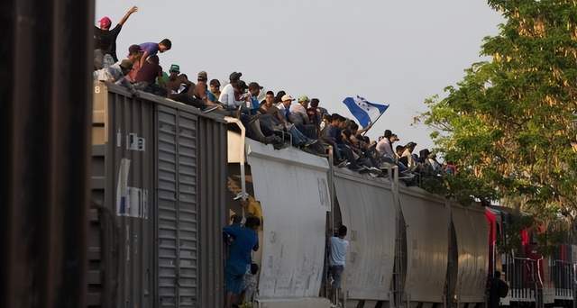 Illegal immigration hits record high of 3.2 million as large groups travel to US on freight trains