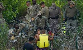 US threatens to sue Texas over law allowing state police to arrest migrants