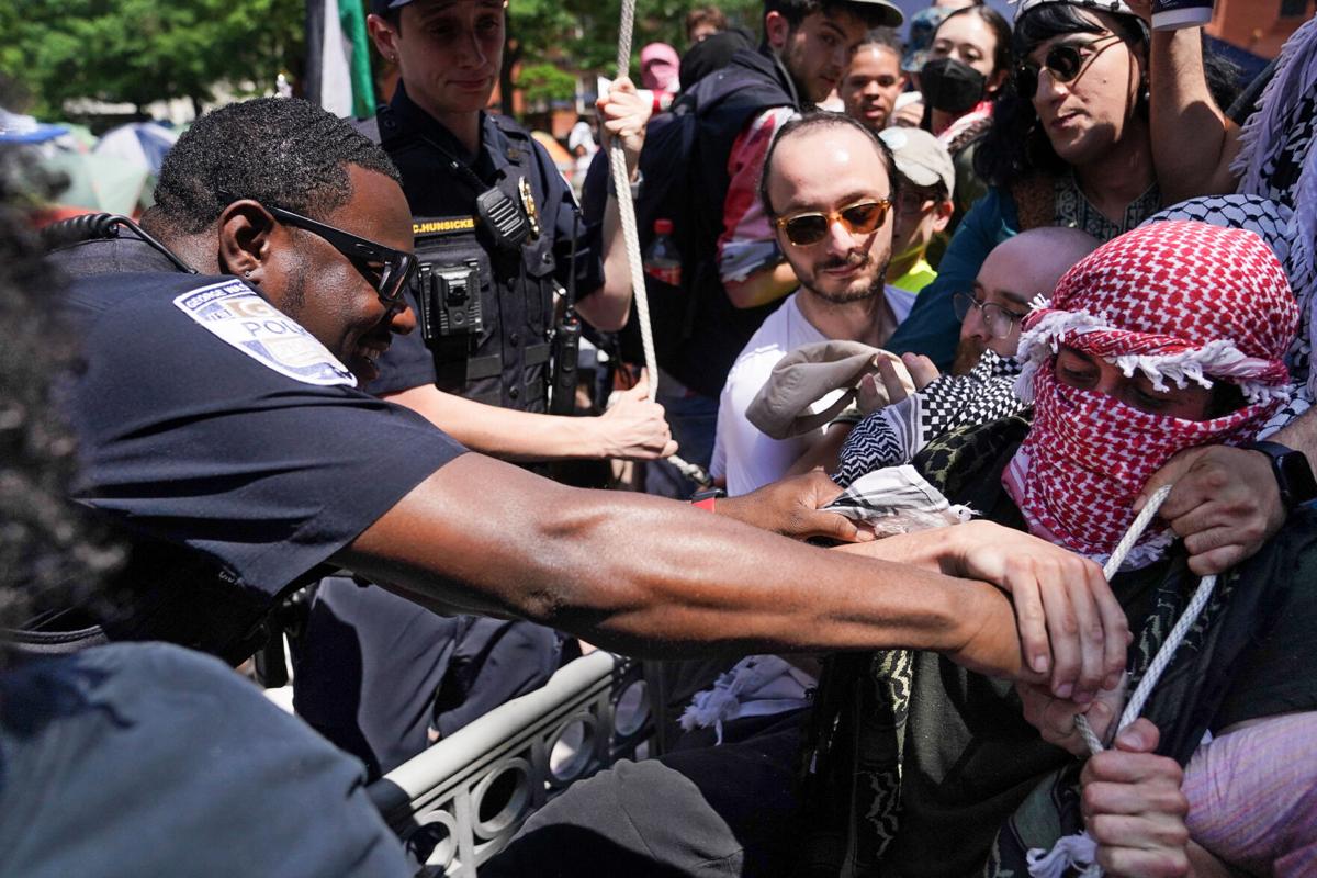 Police clear pro-Palestinian protest camp and arrest 33 at DC campus as mayor’s hearing is canceled