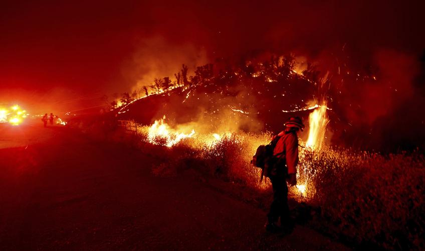 Wildfires plague the West amid a scorching heat wave