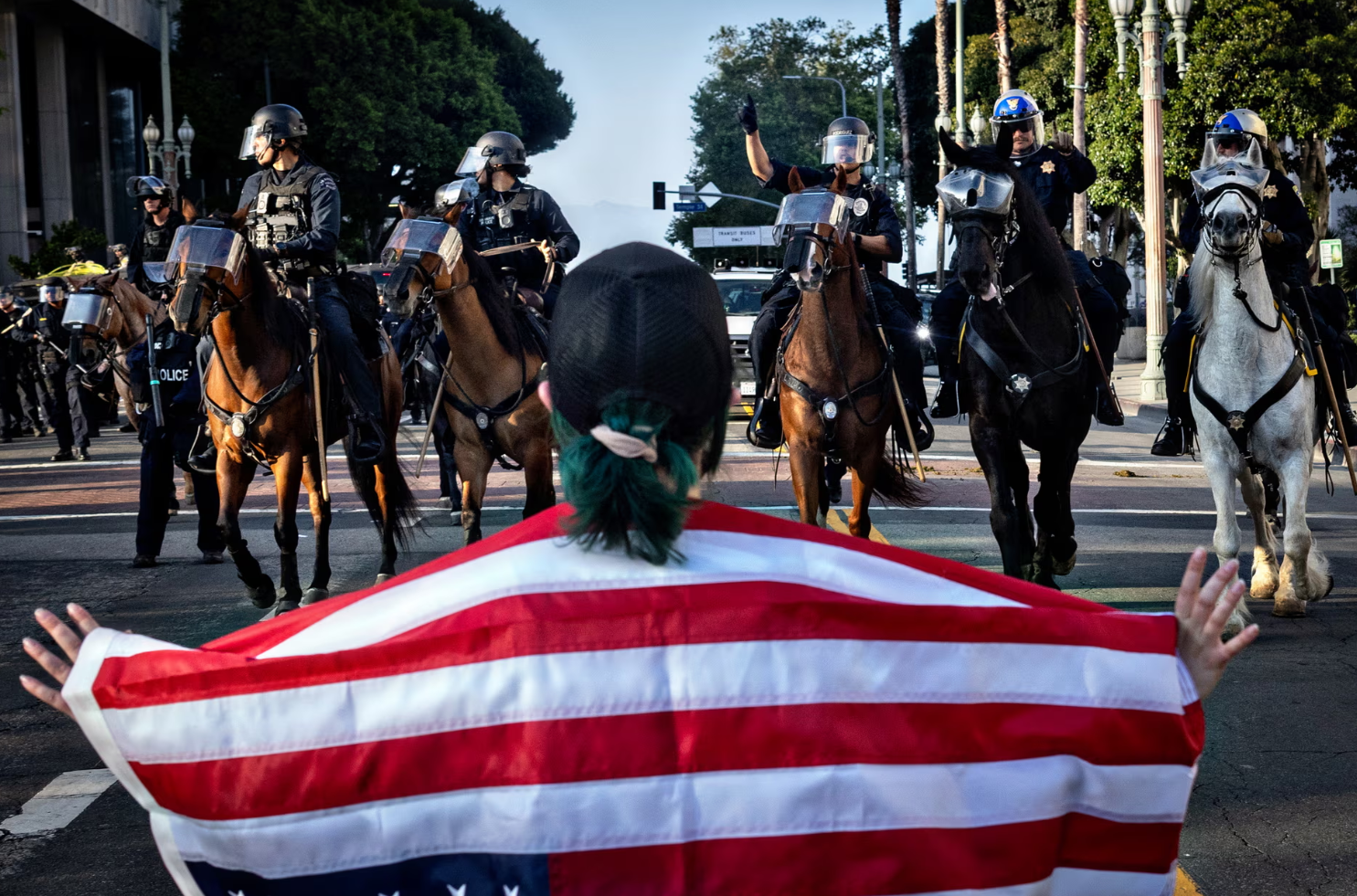 Ice agents detain US citizen as LA immigration raids continue: ‘It’s racial profiling’