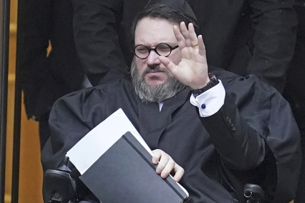 Trial opens for U.S. fugitive accused of faking his own death to avoid rape charges