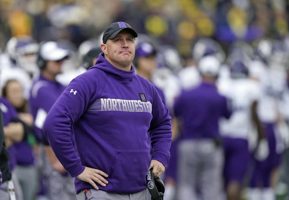 Northwestern reaches settlement with football coach who was fired amid hazing scandal