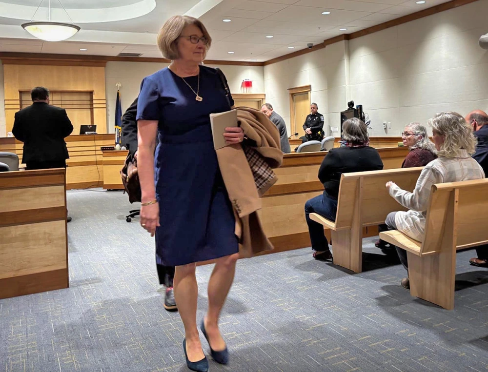 New Hampshire judge accused of trying to meddle in probe of her husband returns to the bench