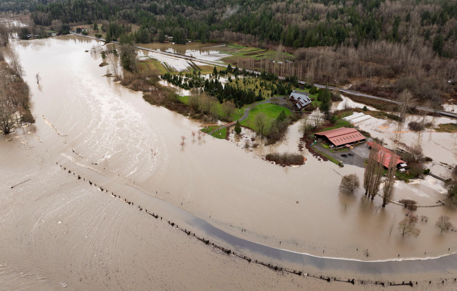 Powerful storms dump heavy rain and swell rivers across US Pacific north-west